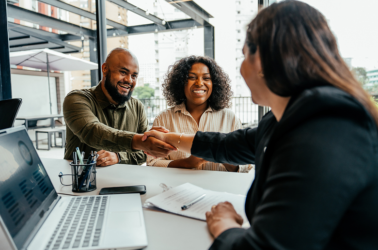 Handshake between businesspeople at a meeting.